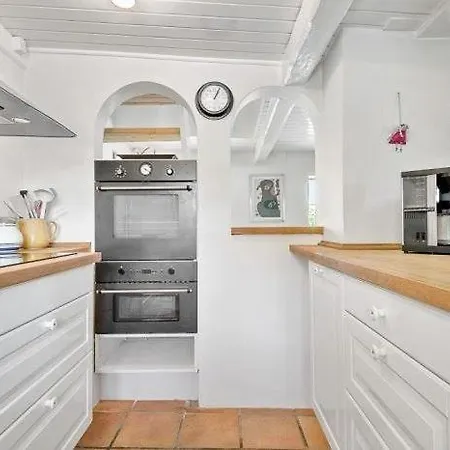 Reetdach-ferienhaus-mit-traumhaftem-panoramameerblick Vakantiehuis